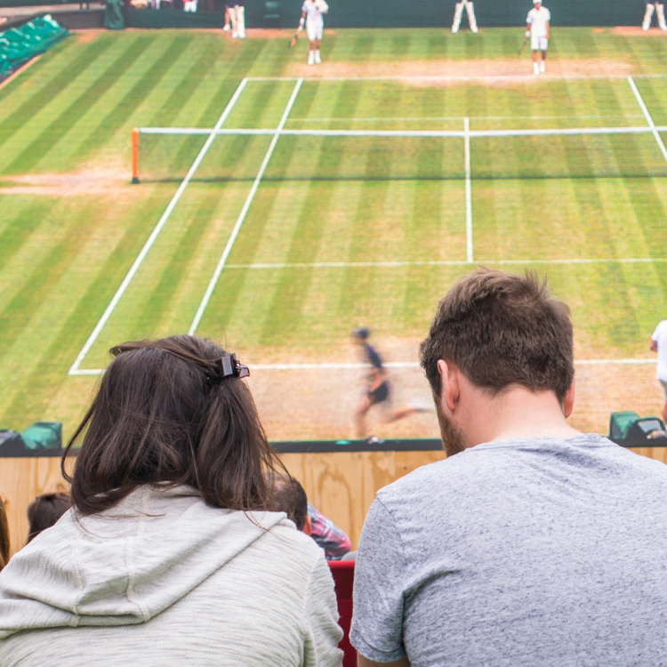 Man and woman watching Wimbledon<br />
